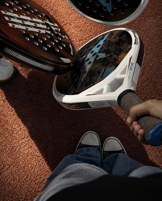 Padel racquets on a Padel Core court